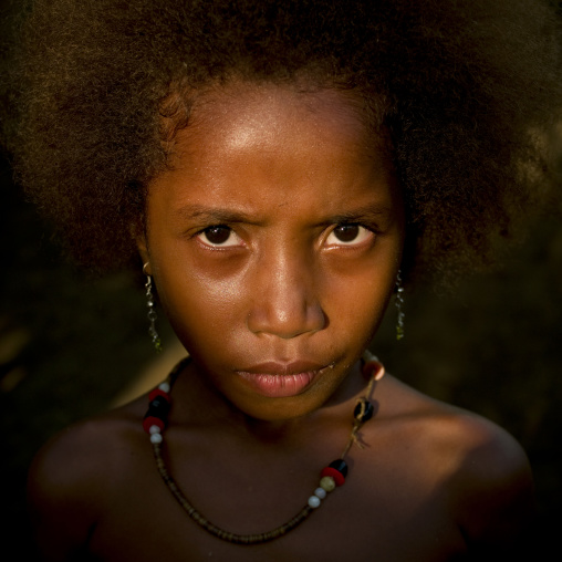 Islander girl in the sun, Milne Bay Province, Trobriand Island, Papua New Guinea