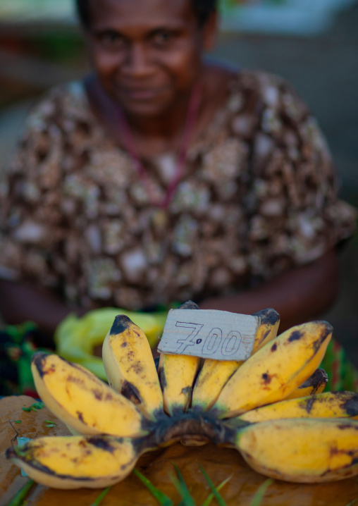 Woman selling bananas in a market, East New Britain Province, Rabaul, Papua New Guinea