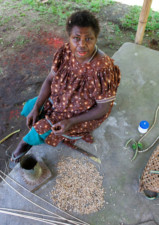 Woman making shell money, East New Britain Province, Rabaul, Papua New Guinea