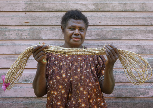 Woman holding a giant shell money, East New Britain Province, Rabaul, Papua New Guinea