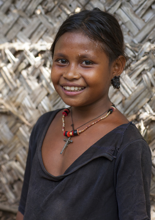 Portrait of a young girl smiling, Milne Bay Province, Trobriand Island, Papua New Guinea
