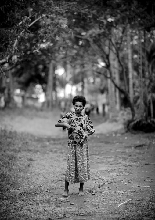 Portrait of a girl in a field, Milne Bay Province, Trobriand Island, Papua New Guinea