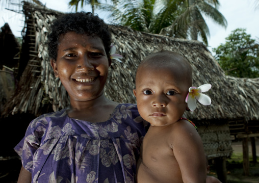 Mother and child, Milne Bay Province, Trobriand Island, Papua New Guinea