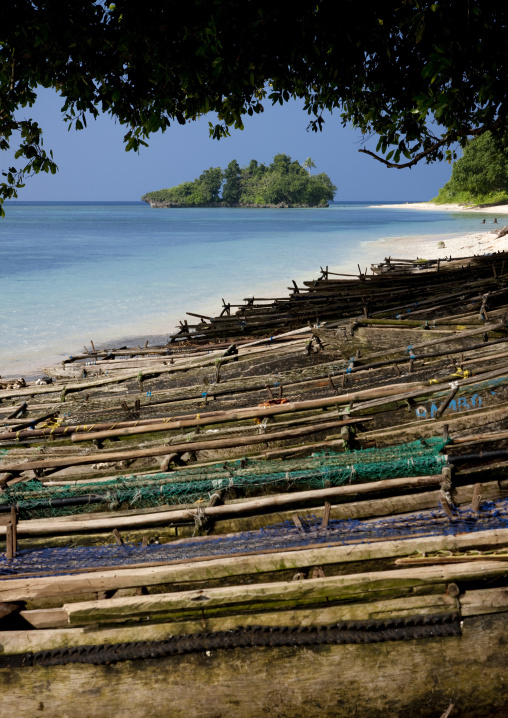Boats on the beautiful deserted kaibola beach, Milne Bay Province, Trobriand Island, Papua New Guinea