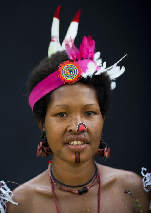 Portrait of a smiling tribal woman in traditional clothing, Milne Bay Province, Trobriand Island, Papua New Guinea