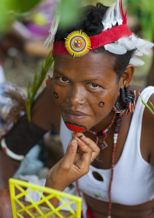 Tribal woman makeup before a ceremony, Milne Bay Province, Trobriand Island, Papua New Guinea