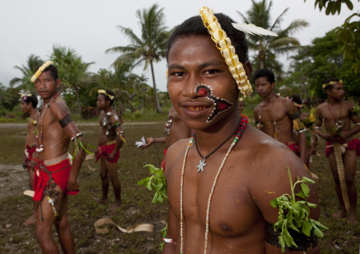 Tribal dancers in traditional clothing during a sing-sing, Milne Bay Province, Trobriand Island, Papua New Guinea