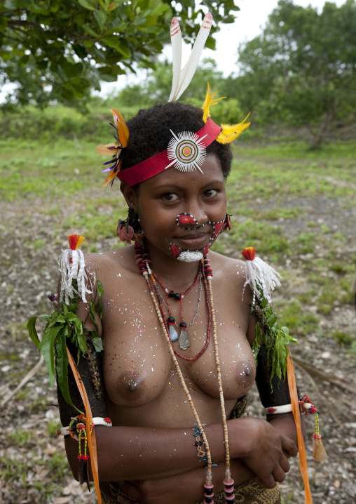Tribal woman with traditional clothing during a ceremony, Milne Bay Province, Trobriand Island, Papua New Guinea