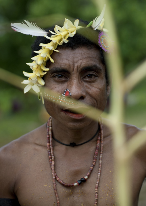 Man in traditional clothing during a ceremony, Milne Bay Province, Trobriand Island, Papua New Guinea