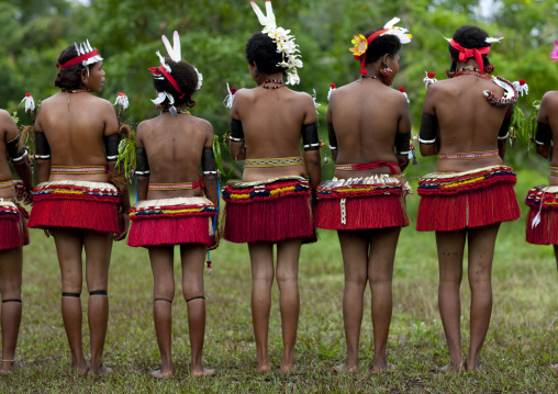 Portrait of topless tribal women in traditional clothing, Milne Bay Province, Trobriand Island, Papua New Guinea