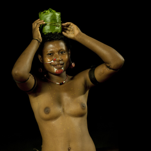 Portrait of a topless tribal woman, Milne Bay Province, Trobriand Island, Papua New Guinea