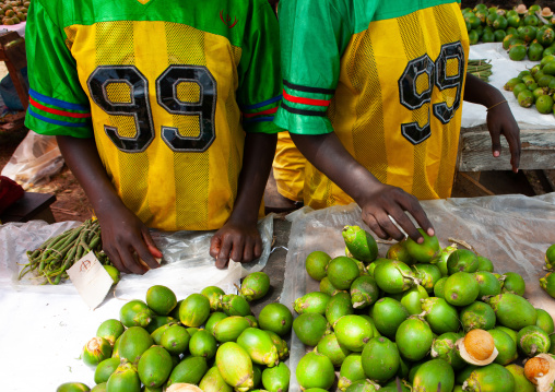 Women with the same sport shirt selling fresh betel nuts in a market, Autonomous Region of Bougainville, Bougainville, Papua New Guinea