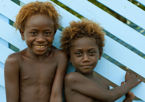 Smiling girls with orange hair, Autonomous Region of Bougainville, Bougainville, Papua New Guinea