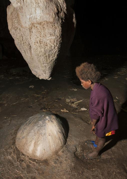 Girl inside momuni sacred cave, Autonomous Region of Bougainville, Bougainville, Papua New Guinea