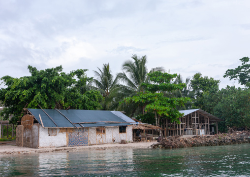 Protection against rising sea levels in a costal village, Autonomous Region of Bougainville, Bougainville, Papua New Guinea