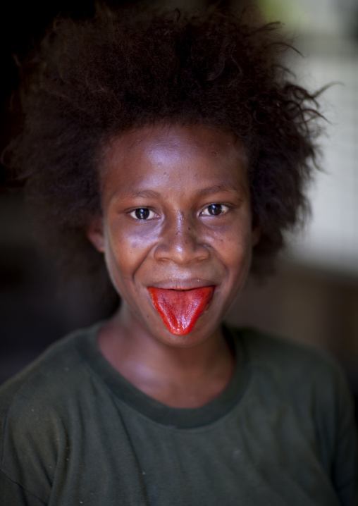 Girl with red tongue after chewing betel, New Ireland Province, Kapleman, Papua New Guinea