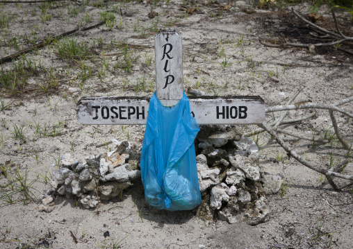 Grave with a plastic bag in a village, New Ireland Province, Laraibina, Papua New Guinea