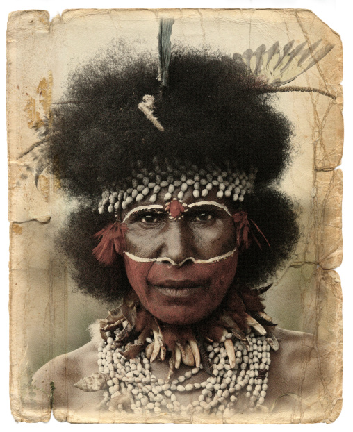 Papuan woman with red tribal makeup on the face, Western Highlands Province, Mount Hagen, Papua New Guinea