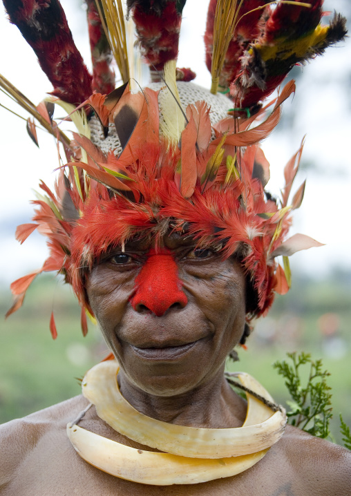 Portrait of a Chimbu tribe woman with headdress made of feathers during a Sing-sing, Western Highlands Province, Mount Hagen, Papua New Guinea