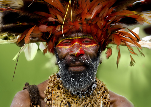Chimbu tribe man with giant headdress made of eagle feathers during a sing sing , Western Highlands Province, Mount Hagen, Papua New Guinea