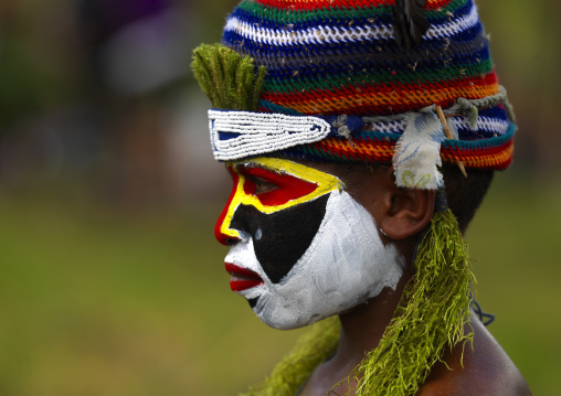 Highlander boy with traditional makeup during a sing-sing, Western Highlands Province, Mount Hagen, Papua New Guinea