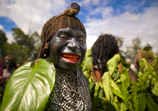 Portrait of a Emira tribe woman with betel smile during a Sing-sing ceremony, Western Highlands Province, Mount Hagen, Papua New Guinea