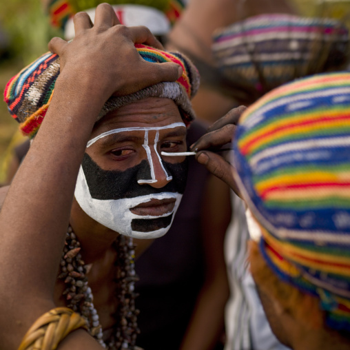 Man having traditonal makeup before a Sing-sing ceremony, Western Highlands Province, Mount Hagen, Papua New Guinea