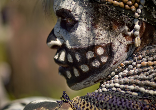 Skeleton tribe woman during a sing-sing ceremony, Western Highlands Province, Mount Hagen, Papua New Guinea