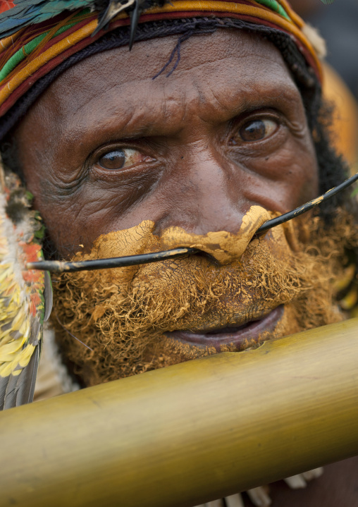 Man playing flute during a sing-sing, Western Highlands Province, Mount Hagen, Papua New Guinea