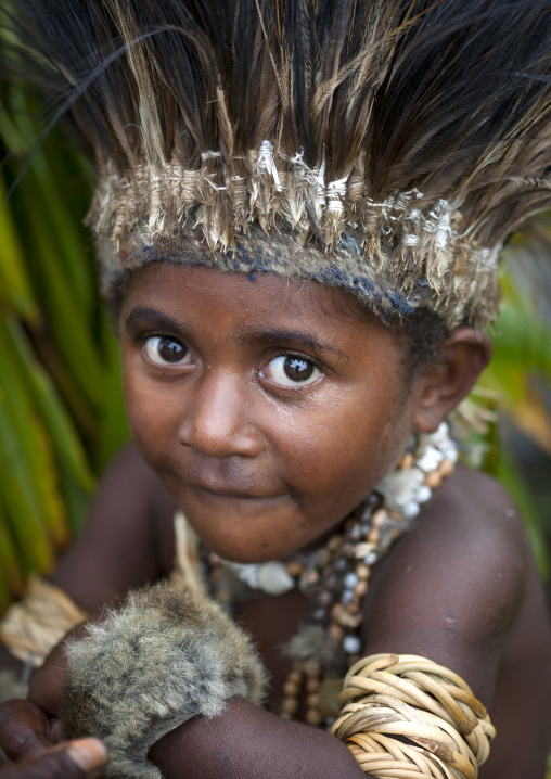 Chimbu tribe boy with a feathers headwear during a Sing-sing ceremony, Western Highlands Province, Mount Hagen, Papua New Guinea