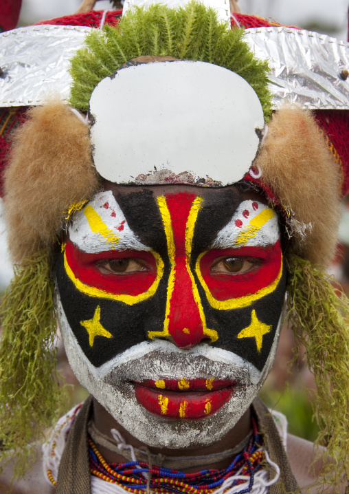 Portrait of a Highlander young warrior with traditional makeup during a sing-sing, Western Highlands Province, Mount Hagen, Papua New Guinea