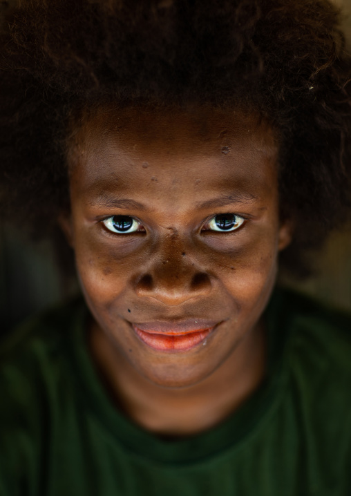 Portrait of a young girl smiling, New Ireland Province, Kapleman, Papua New Guinea