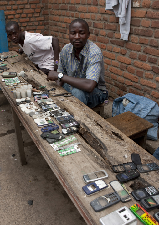 Rwandan man repairing mobile phones in the market, Lake Kivu, Gisenye, Rwanda