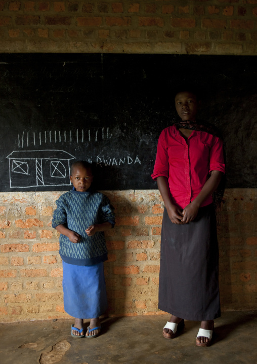 Child with her teacher in a primary school, Nyungwe Forest National Park, Gisakura, Rwanda