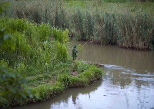 Rwandan man fishing in the countryside, Northwest Province, Rehengeri, Rwanda