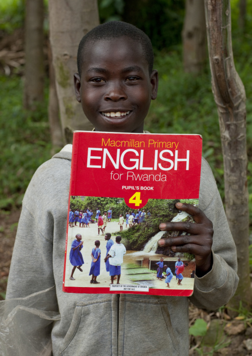 Rwandan boy with an english course book, Northwest Province, Rehengeri, Rwanda