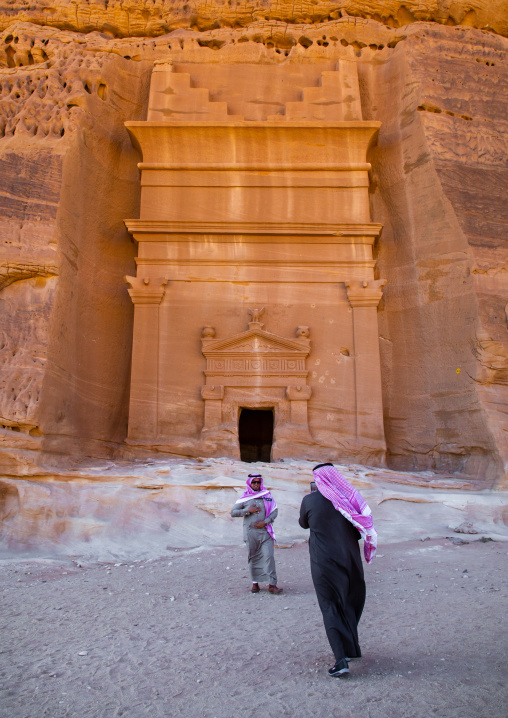 Saudi tourists in front of a tomb in al-Hijr archaeological site in Madain Saleh, Al Madinah Province, Alula, Saudi Arabia