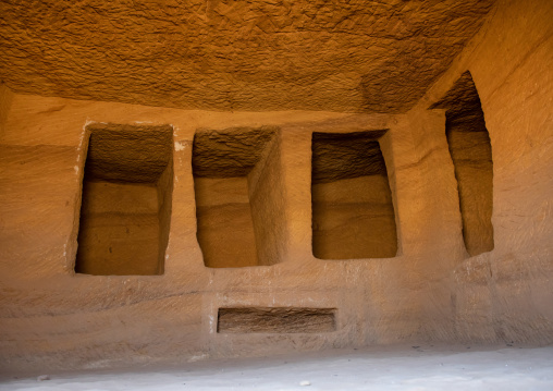 Holes for the coffins inside a tomb in al-Hijr archaeological site in Madain Saleh, Al Madinah Province, Alula, Saudi Arabia