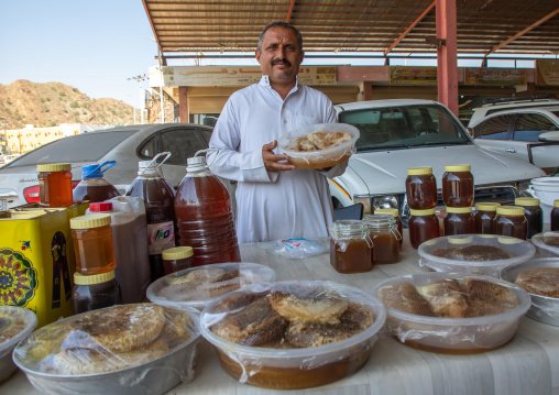 Portrait of a saudi man selling honeycombs and honey in a market, Asir province, Rijal Alma, Saudi Arabia
