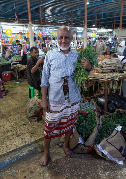 Portrait of a saudi man in a market buying herbs, Jizan province, Sabya, Saudi Arabia