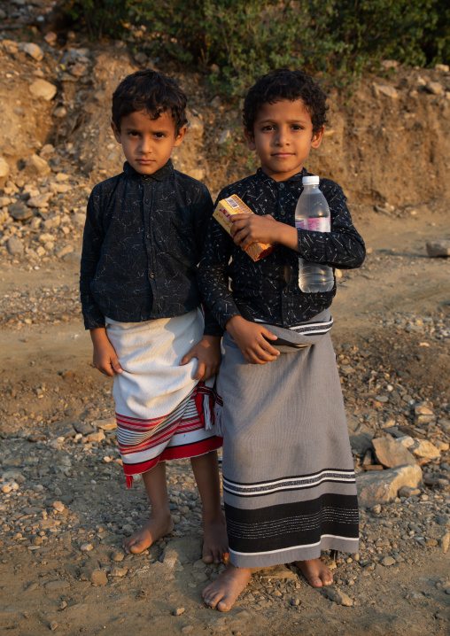 Portrait of two barefoot children wearing futhas, Jizan province, Alaydabi, Saudi Arabia