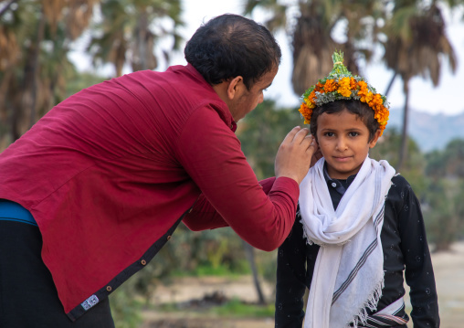 Portrait of a flower boy wearing a floral crown on the head, Jizan province, Alaydabi, Saudi Arabia
