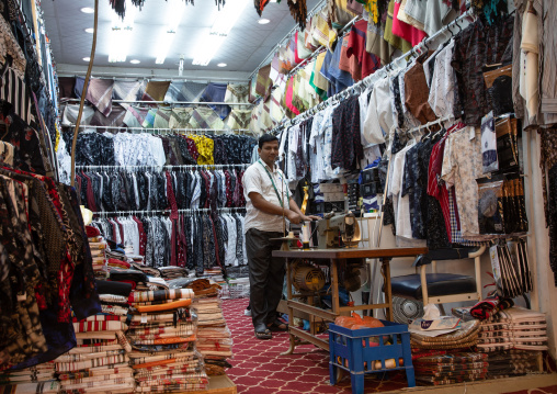 Indian tailor in a shop, Jizan province, Addayer, Saudi Arabia