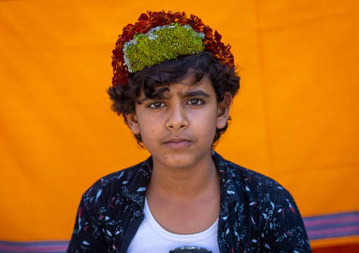Portrait of a flower boy wearing a floral crown on the head, Jizan province, Addayer, Saudi Arabia