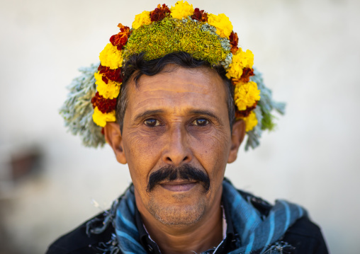 Portrait of a flower man wearing a floral crown on the head, Jizan province, Addayer, Saudi Arabia