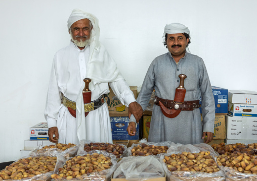 Portrait of saudi men selling dates in a shop, Najran Province, Najran, Saudi Arabia