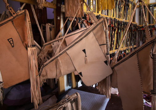 Traditional leather cradles with fringes for sale in a shop, Najran Province, Najran, Saudi Arabia