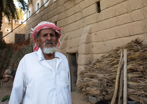 Portrait of a saudi man in front of his house, Najran Province, Najran, Saudi Arabia