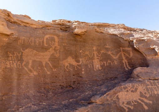 Petroglyphs rock art depicting humans and ibex, Najran Province, Thar, Saudi Arabia