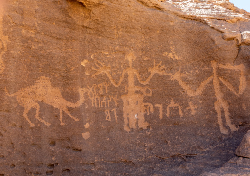 Petroglyphs rock art depicting humans and camel, Najran Province, Thar, Saudi Arabia